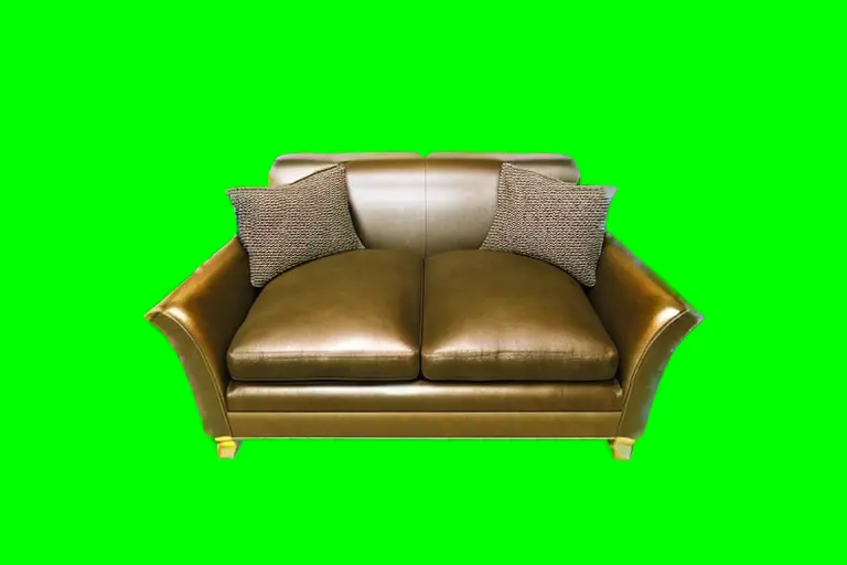 An image showing the image generated, still with green screen background, but with a filled-in sofa.